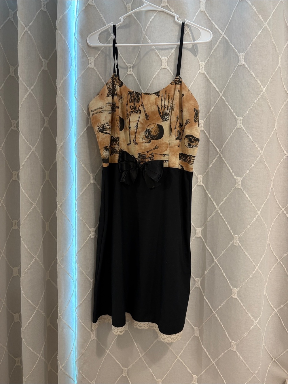 Black Slip Dress with Beige Skeleton Print Bodice